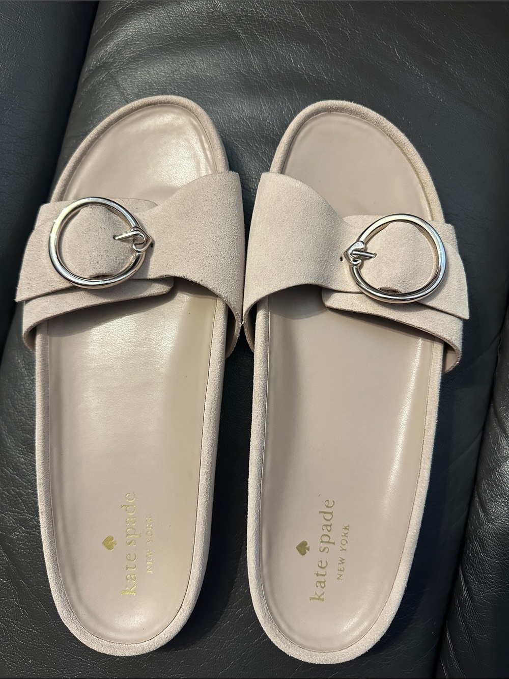 Kate Spade beige suede slide sandals with round silver buckles
